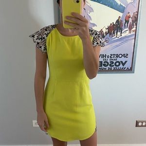 Bold yellow mini dress with unique sleeve detail by Akira